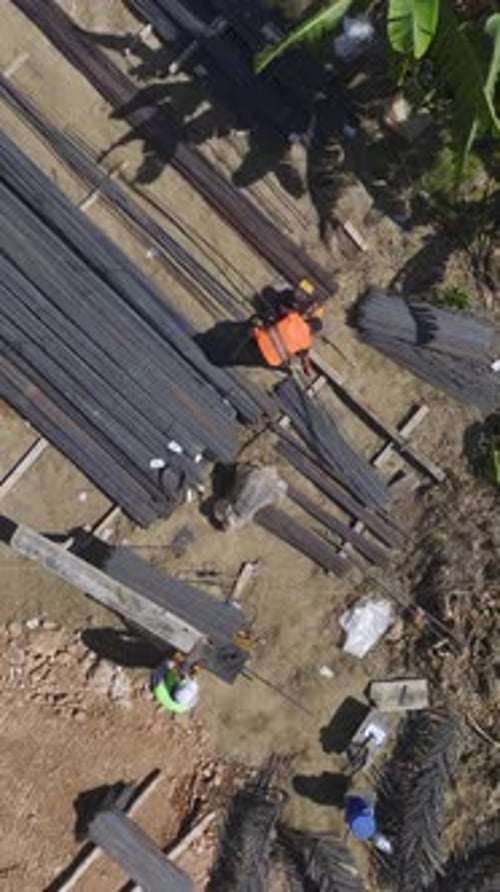 Construction Workers Laboring at Busy Urban Building Site