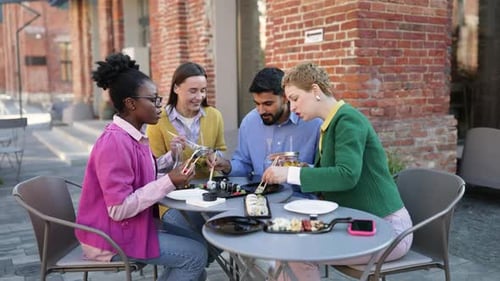 Friends Eating Sushi Outdoors