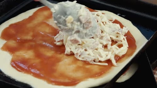 Adding Ingredients To Home Made Pizza Base