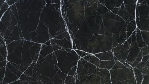 White lines marked on frozen surface of lake, cracks in ice, aerial