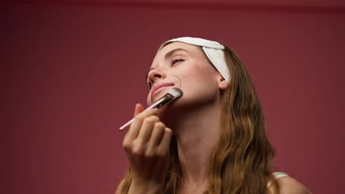 Close Studio Decorate on Pink Background Beautiful Girl in Underwear Stands with Foundation Brush