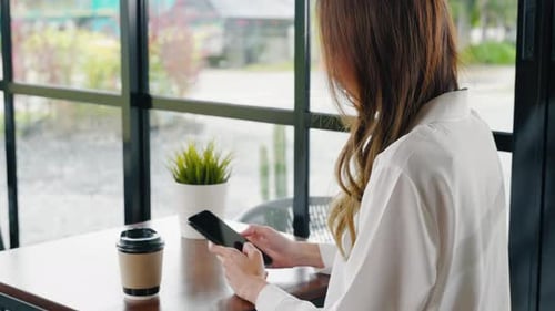Happy Female Lifestyle Sitting in Cafe Near Window She Cellphone on Mobile Phone