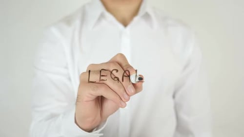 Man Writes "Legal" on Clear Surface