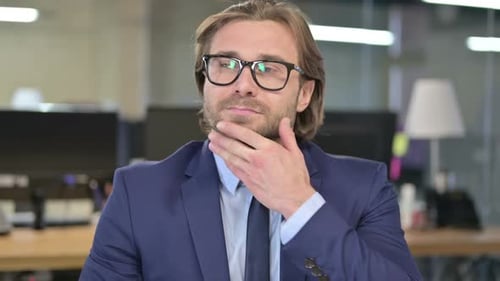 The Portrait of Pensive Businessman Thinking New Idea