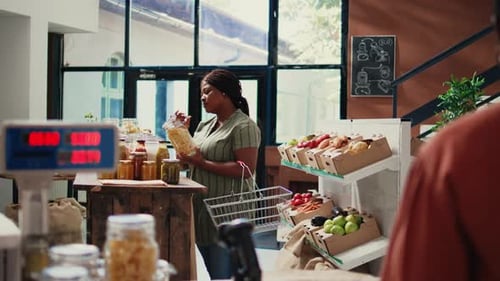 Woman Shopping Jars in Urban Grocery Store