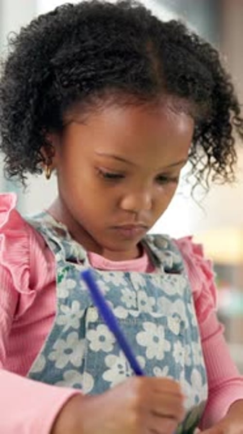 Color, education and kid with drawing in classroom for creativity, growth or development