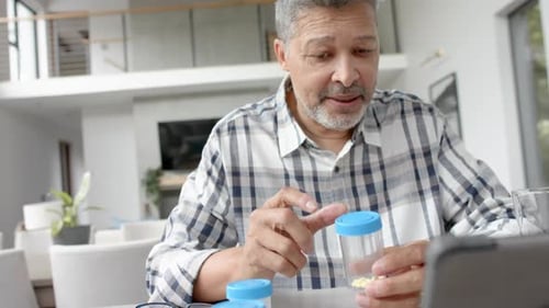 Man Discussing Medication During Telehealth Appointment