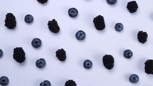 Rotating Blackberry Berries on White Background Top View