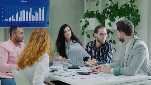 Diverse Office Team Joyfully Exchange High Fives in a Corporate Brainstorming Session An Group