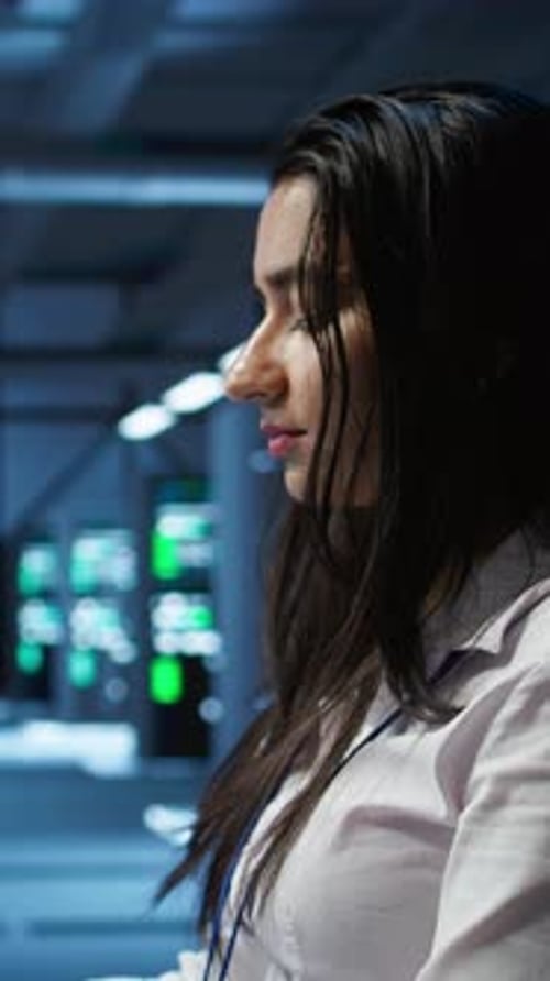 Vertical Video Computer Scientist in Data Center Monitoring Security Threats Using Computer