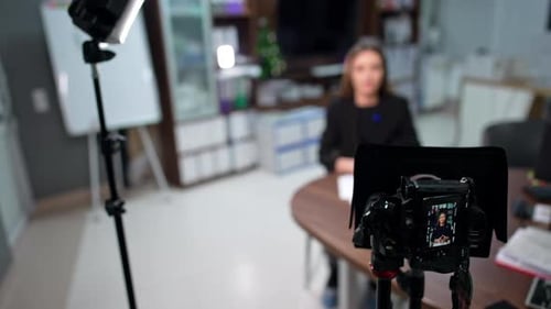Woman Recording Video in a Home Office