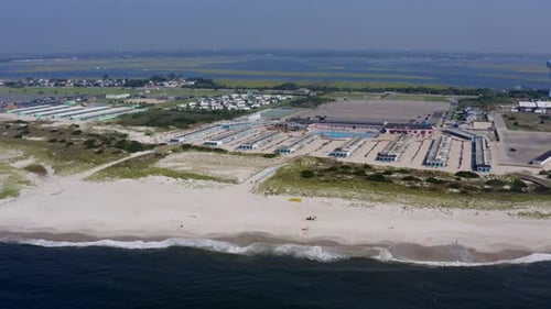 The beautiful contrast of cresting waves against white sand in Long Island
