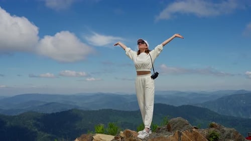 Woman Enjoying Mountain View on Beautiful Sunny Day