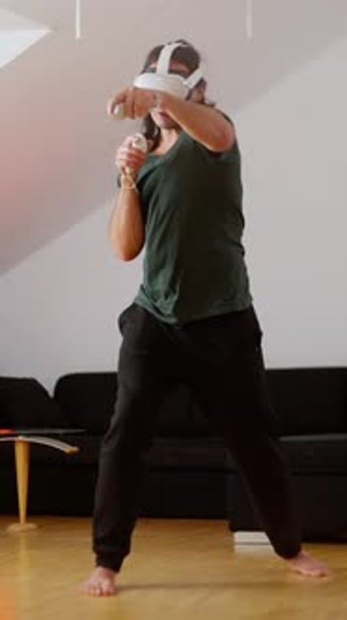 Man Enjoys VR Workout at Home Boxing