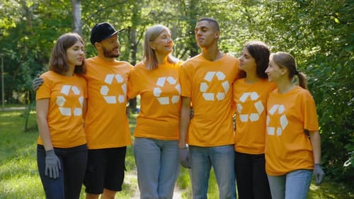 Portrait of the Group of the Eco Volunteer Standing Together in the Clean Forest Looking at the