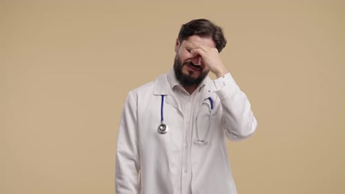 Stressed Doctor with Beard in Lab Coat