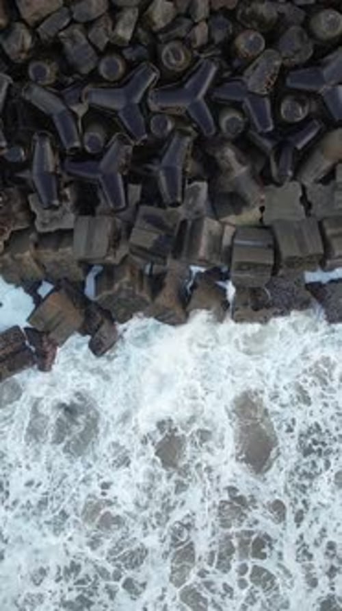 Vertical Video of Big Waves Crashing on the Pier on Storm Day