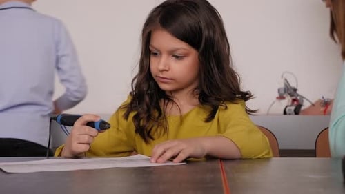 Young Girl Using 3D Printing Pen in Classroom