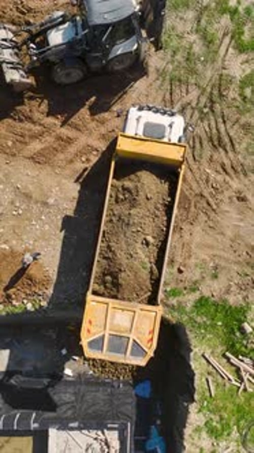 Vertical Video Busy Construction Timelapse with Builders and Machinery Advancing a FastPaced