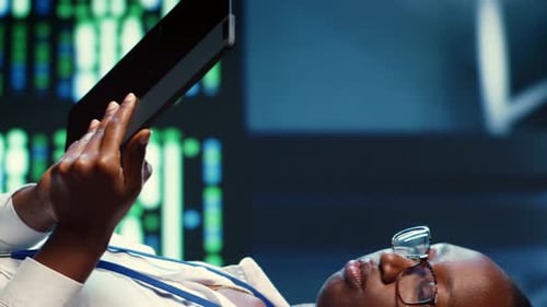 Vertical Video Woman Strolls Through Data Center Rows