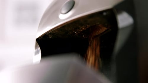 A coffee grinder grinds coffee.