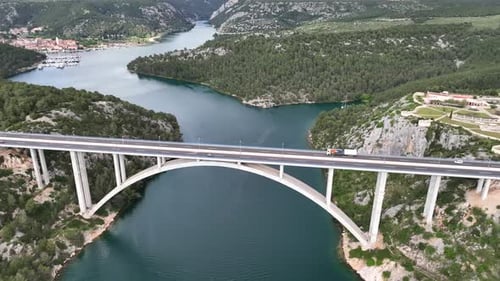 Drone flight above a beautiful arch bridge near the town of Shibenik in Croatia