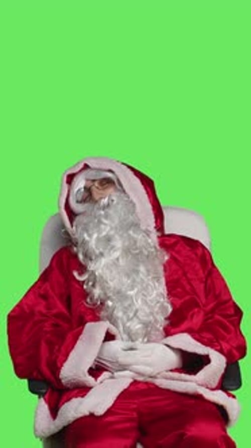 Vertical Video Front View of Santa Claus Character on Chair