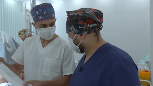 Medical Professionals Collaborating in Hospital Operating Room