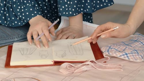 Clothing Design and Sketches in Notebook