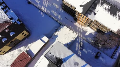 Aerial View of a Snowy Urban Winterscape