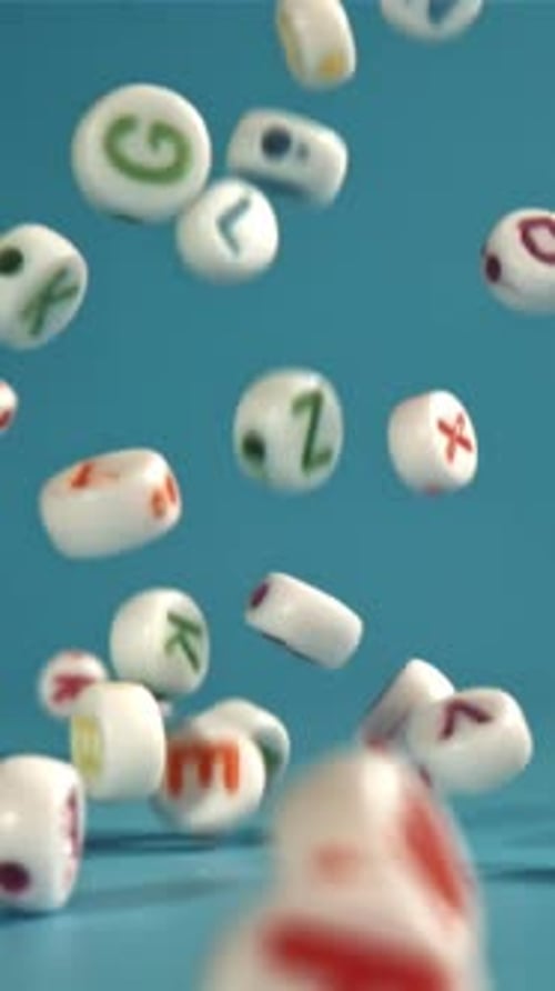Falling Letters on a Blue Background Filmed on a Highspeed Camera at 1000 Fps