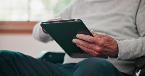 Senior Man Using a Tablet at Home
