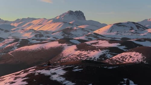 Aerial view of snowy Apennine peaks near Rocca Calascio, Italy.