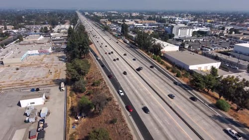 Aerial view overlooking traffic on the 405 Freeway, on a sunny day, In Los Angeles, California, USA