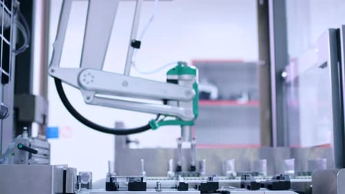 Medicine package moving on automated conveyor belt at pharmaceutical factory