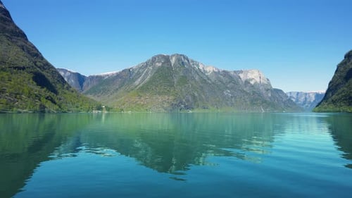 Along the way there are snow-capped mountains, waterfalls and lake reflections.