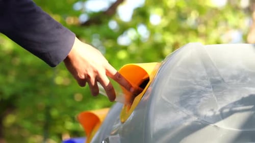 Recycling Plastic Bottle in Urban Park Setting