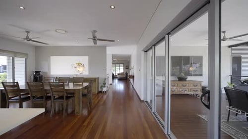 Contemporary home, kitchen, dining living room into spacious lounge room. White stone bench tops and