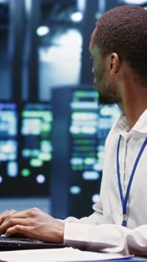 Portrait Format Computer Scientist Repairs Server Network Performance Issues