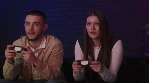 Couple Playing Video Games in Dark Room