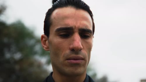 Close-Up of a serious man with slicked back hair