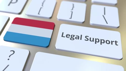 Legal Support Text and Flag of Luxembourg on the Keyboard