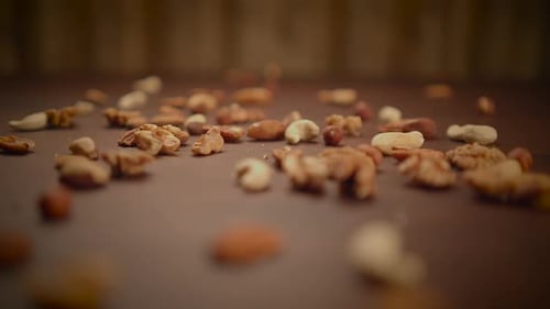 Scattered Mixed Nuts on a Wooden Table