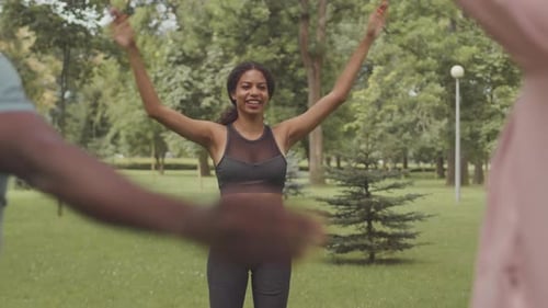 Woman Leads Exercise Class in Grassy Park