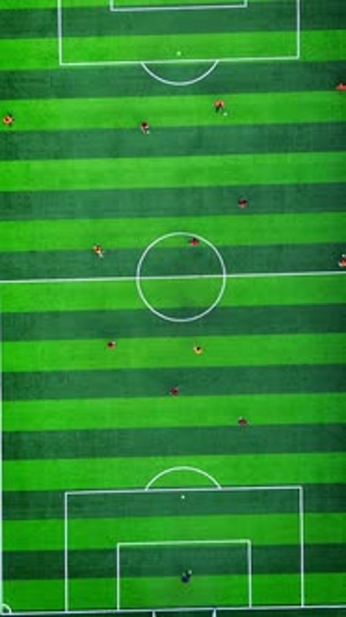 Vertical Drone Footage of mini football match, soccer. MiniFootball field and Footballers from drone