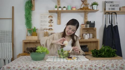 Woman Preparing Healthy Salad in Bright Kitchen