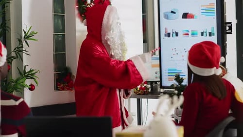Santa Claus Presents to Office Workers at Christmas