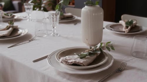 Elegant table setting with linens, plates, and glassware