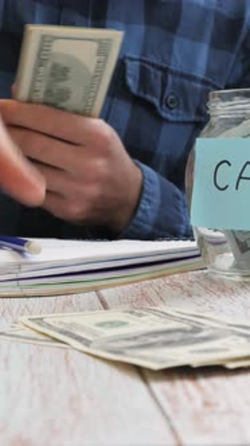 Man Saving Money for Car and Taxes