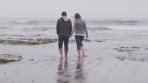 Couple Walking at Beach Together. on Red Epic for High Quality